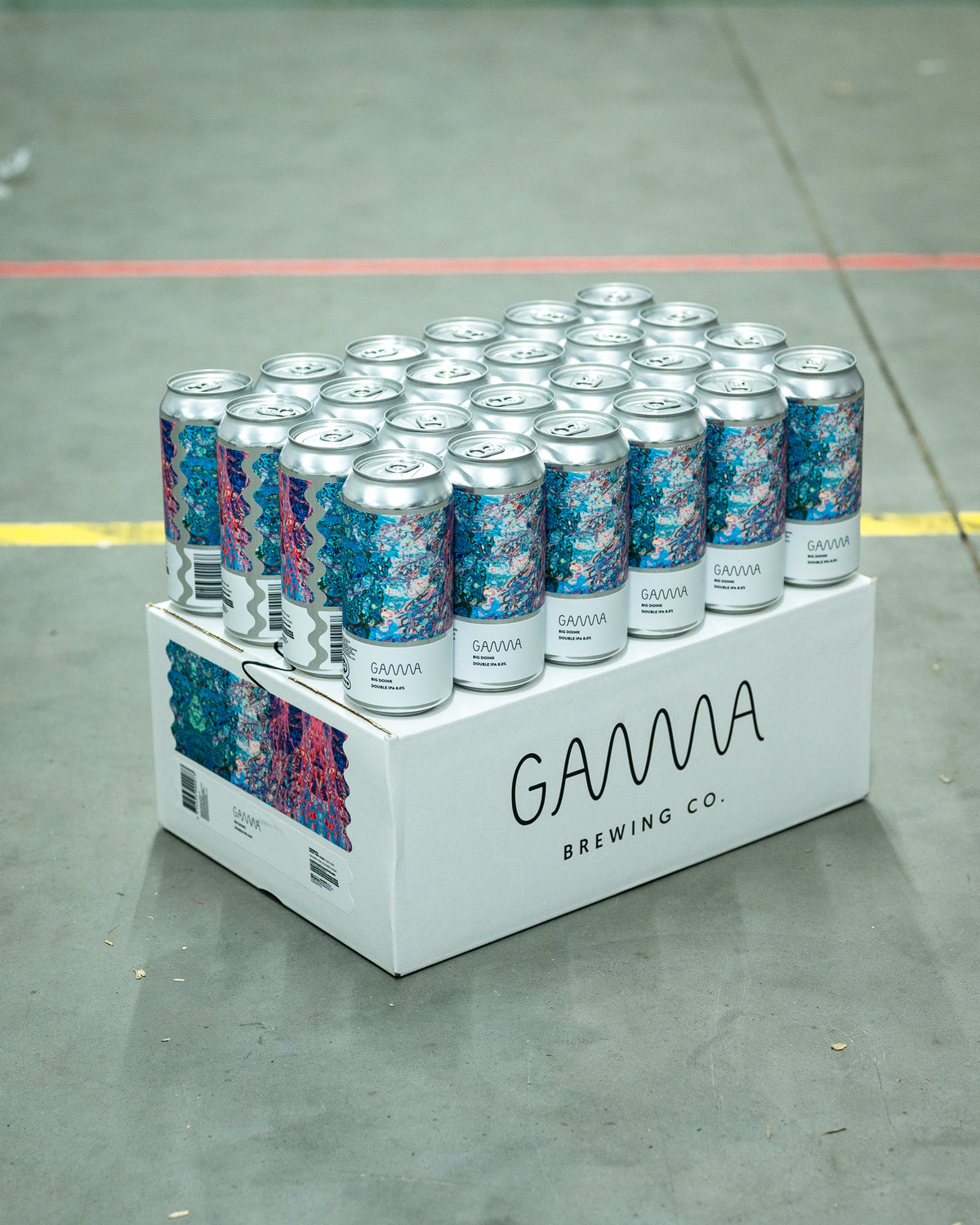 24 Gamma Brewing's Big Doink double IPA beers with an abstract design, presented on top of a gamma shipping box.